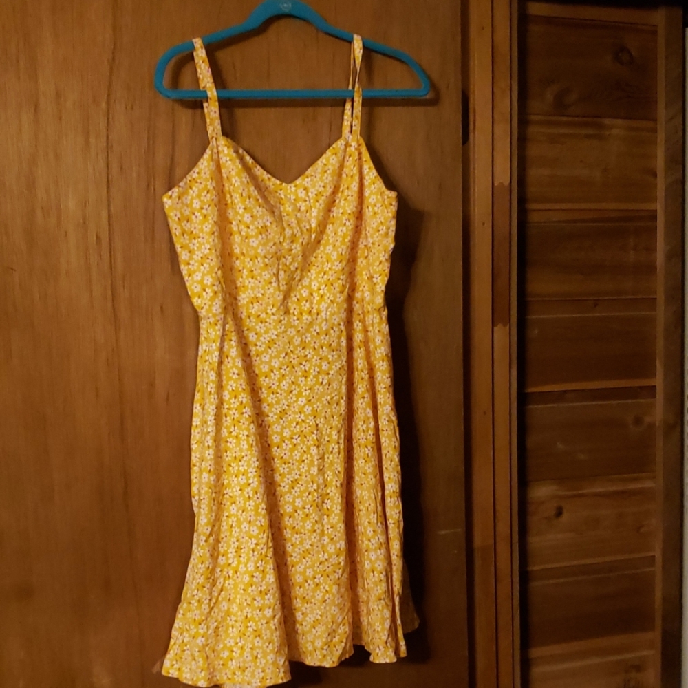 Dress yellow mustard with flowers.